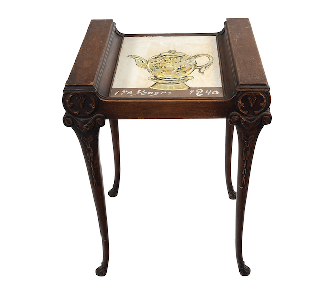 Side table with teapot image painted by Ira Yeager, estimated at $500-$700. Image courtesy of Michaan’s Auctions