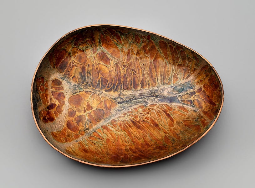 June Schwarcz (1918–2015), ‘Basse-taille Dish (#629),’ 1974. Hammered copper bowl, basse-taille enamel. Collection of Forrest L. Merrill. L2023.0601.005. Image courtesy of the SFO Museum