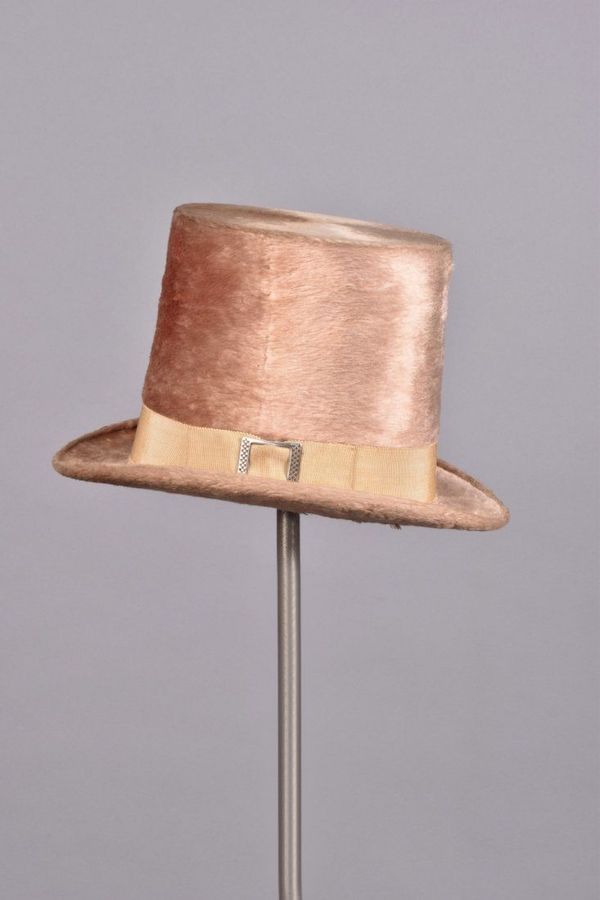 A circa-1830 gentleman’s pink beaver plush high hat, made in London and featuring an ivory grosgrain ribbon band with a silver buckle, realized $2,100 plus the buyer’s premium in October 2016. Image courtesy of Charles A. Whitaker Auction Co. and LiveAuctioneers