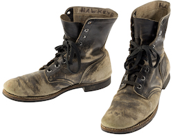 The combat boots and dog tags (not shown) Alan Alda wore while playing Hawkeye Pierce during the 11-season run of the television show ‘MASH’ sold for $125,000 on July 28. Image courtesy of Heritage Auctions