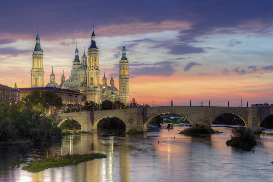 Basilica of Our Lady of the Pillar in Zaragoza, Spain, shot in September 2012. It is among the many iconic churches and religious buildings in Europe that have struggled to remain functional as sites of worship while also welcoming tourists. Image courtesy of Wikimedia Commons, photo credit Jiuguang Wang. Shared under the Creative Commons Attribution-Share Alike 3.0 Spain license.