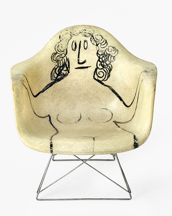 Fiberglass armchair with Steinberg nude. Image courtesy of the Eames Institute of Infinite Curiosity, photo credit Vitra, Tom Ziora