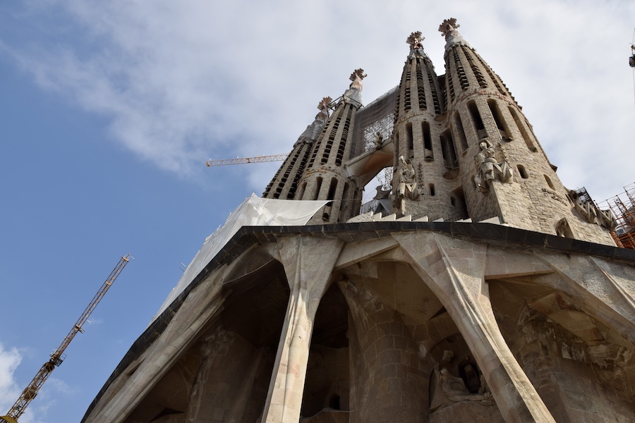 Exterior of the Sagrada Familia Basilica in Barcelona, Spain, designed by Antoni Gaudi, photographed in September 2014. It is among the many iconic churches and religious buildings in Europe that have struggled to remain functional as sites of worship while also welcoming tourists. Image courtesy of Wikimedia Commons, photo credit Ank Kumar. Shared under the Creative Commons Attribution-Share Alike 4.0 International license.