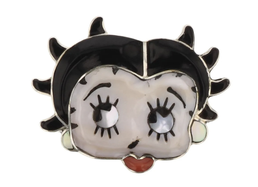 This Don Dewa Zuni inlay shell and coral Betty Boop ring realized $200 plus the buyer’s premium in July 2021. Image courtesy of Billy The Kid Auction House and LiveAuctioneers.