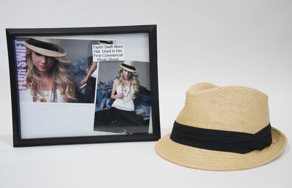 A Taylor Swift-signed fedora, which she wore during her first commercial photo shoot, went for $1,300 plus the buyer’s premium in March 2022. Image courtesy of GWS Auctions Inc. and LiveAuctioneers.