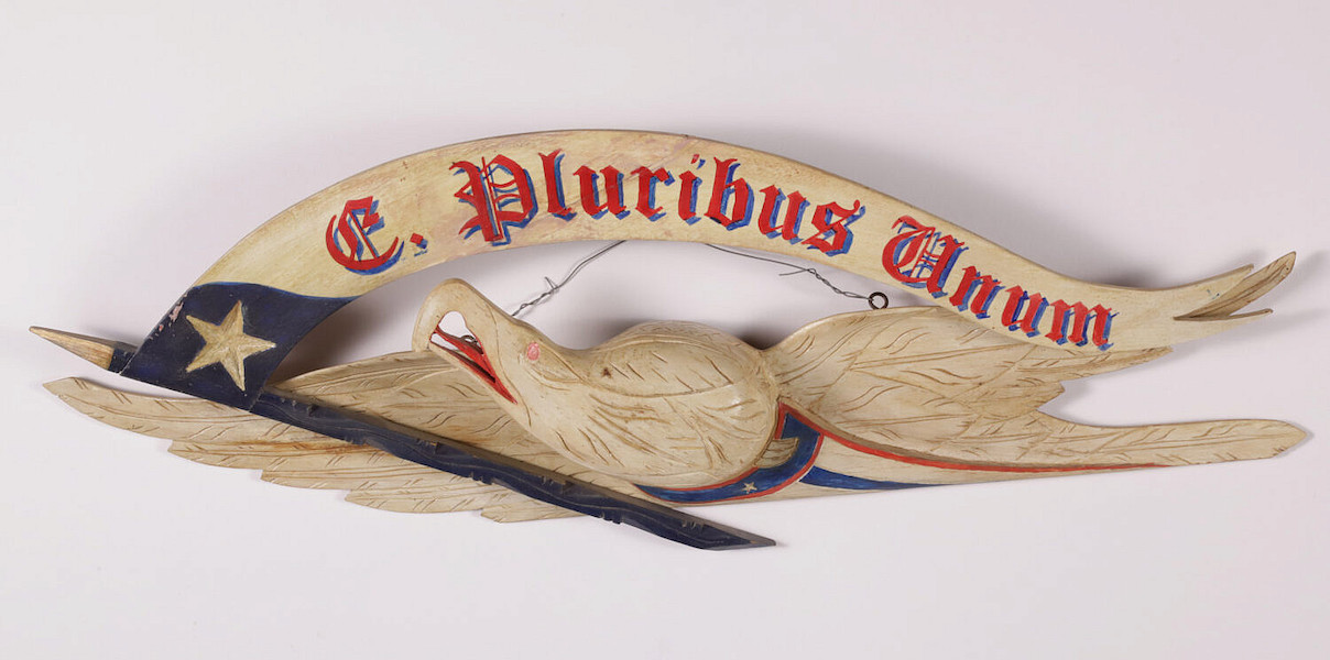 John Haley Bellamy carved eagle with E Pluribus Unum banner, estimated at $6,000-$8,000. Image courtesy of Rafael Osona Auctions
