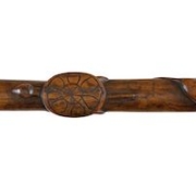 Detail of the wooden walking stick by Henry Gudgell, showcasing a carving of a tortoise. Image courtesy of Guyette & Deeter and LiveAuctioneers.