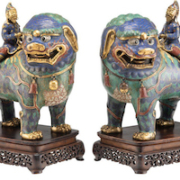 Pair of Chinese cloisonné lions with riders, estimated at $6,000-$8,000 at Heritage Auctions.