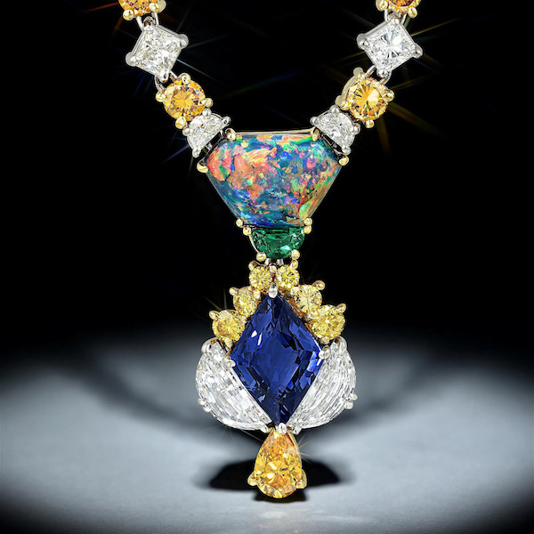 A trapezoid cabochon-cut black opal anchors this immense sapphire, diamond, emerald and 18K gold pendant that realized $22,000 plus the buyer’s premium in March 2020. Image courtesy of Fortuna and LiveAuctioneers.
