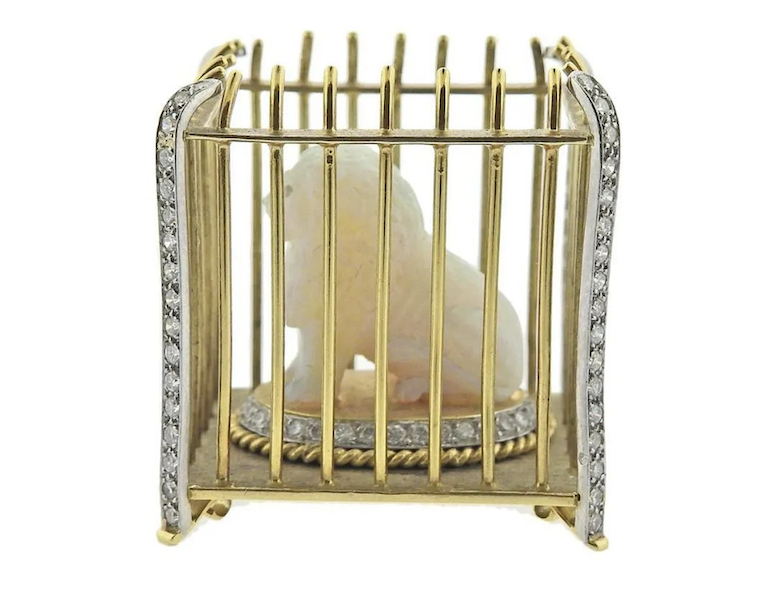 Opals can be easily carved into dramatic shapes, such as this white opal lion figurine placed within an 18K gold cage, which attained $1,800 plus the buyer’s premium in December 2022. Image courtesy of Farber Auctioneers and LiveAuctioneers.