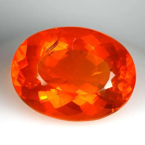 A 14.29-carat GIA-certified red-orange Mexican fire opal rose to $1,600 plus the buyer’s premium in April 2022. Image courtesy of Jasper52 and LiveAuctioneers.