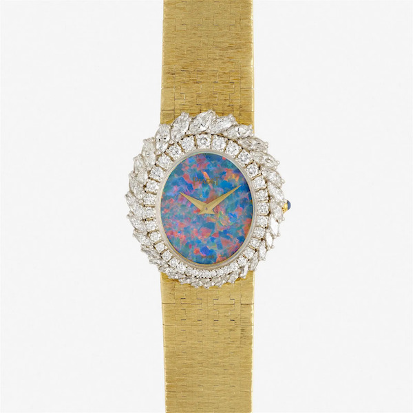 A brilliant opal sets off an 18K yellow and white gold 1970s Piaget wristwatch framed by two rings of diamonds. It sold for $15,000 plus the buyer’s premium in October 2022. Image courtesy of Rago Arts and Auction Center and LiveAuctioneers.