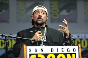 Kevin Smith photographed while speaking at the 2018 San Diego Comic Con International in San Diego, California. The director and comic book superfan has consigned pieces from his personal collection of original comic book art to auction at Bodnar’s on September 28. Image courtesy of Wikimedia Commons, photo credit Gage Skidmore. Shared under the Creative Commons Attribution-Share Alike 2.0 Generic license.