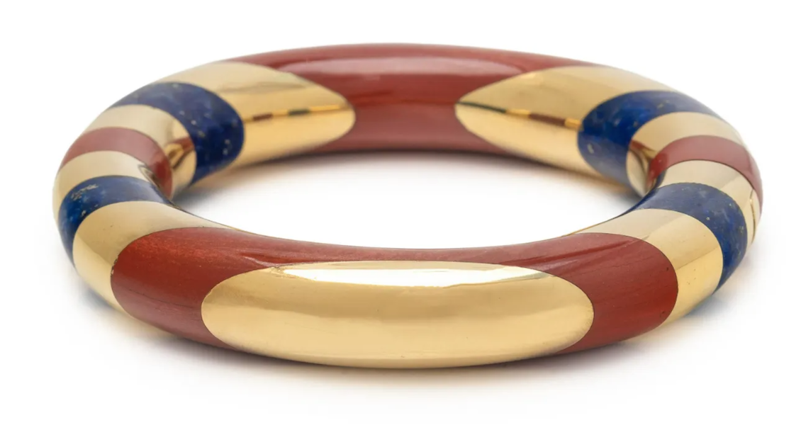 This Angela Cummings for Tiffany & Co. bangle bracelet with inlaid lapis lazuli and jasper sold for $12,000 plus the buyer’s premium in September 2022. Image courtesy of Hindman and LiveAuctioneers.