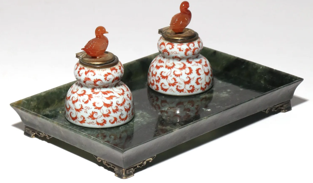 A pair of porcelain inkwells with agate bird finials, sold together with a carved spinach and jade standish, achieved $34,000 plus the buyer’s premium in March 2020. Image courtesy of Butterscotch Auctions and LiveAuctioneers.
