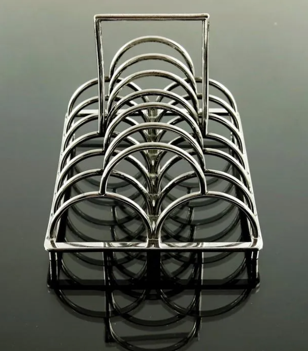 Created by Christopher Dresser circa 1881 for James Dixon and Sons, this silver plated six-division toast rack, model 67, sold for $5,829 plus the buyer’s premium at Kinghams Auctioneers. Image courtesy of Kinghams Auctioneers and LiveAuctioneers.