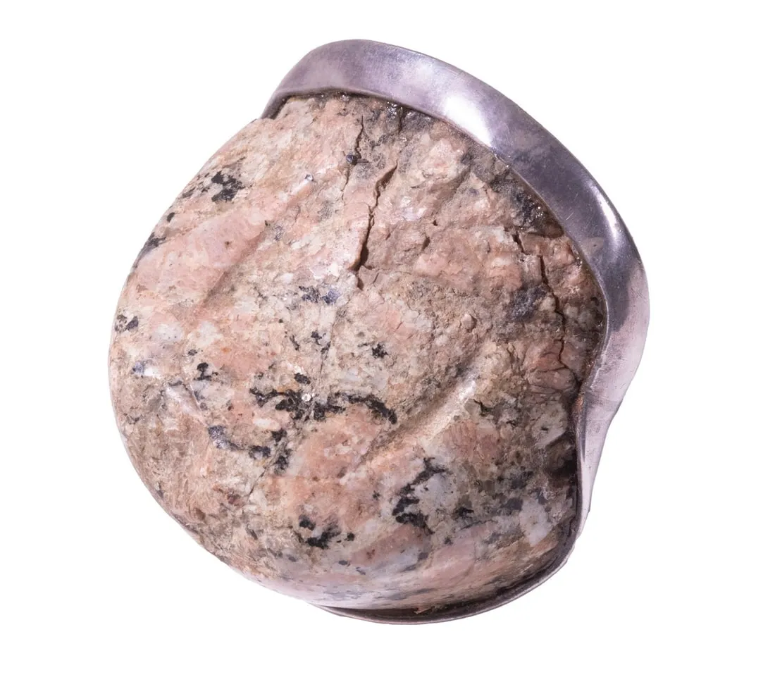 Silver mounted pink granite toenail fragment from a colossal statue of Ramses II, $31,000 at Thomaston Place Auction Galleries.