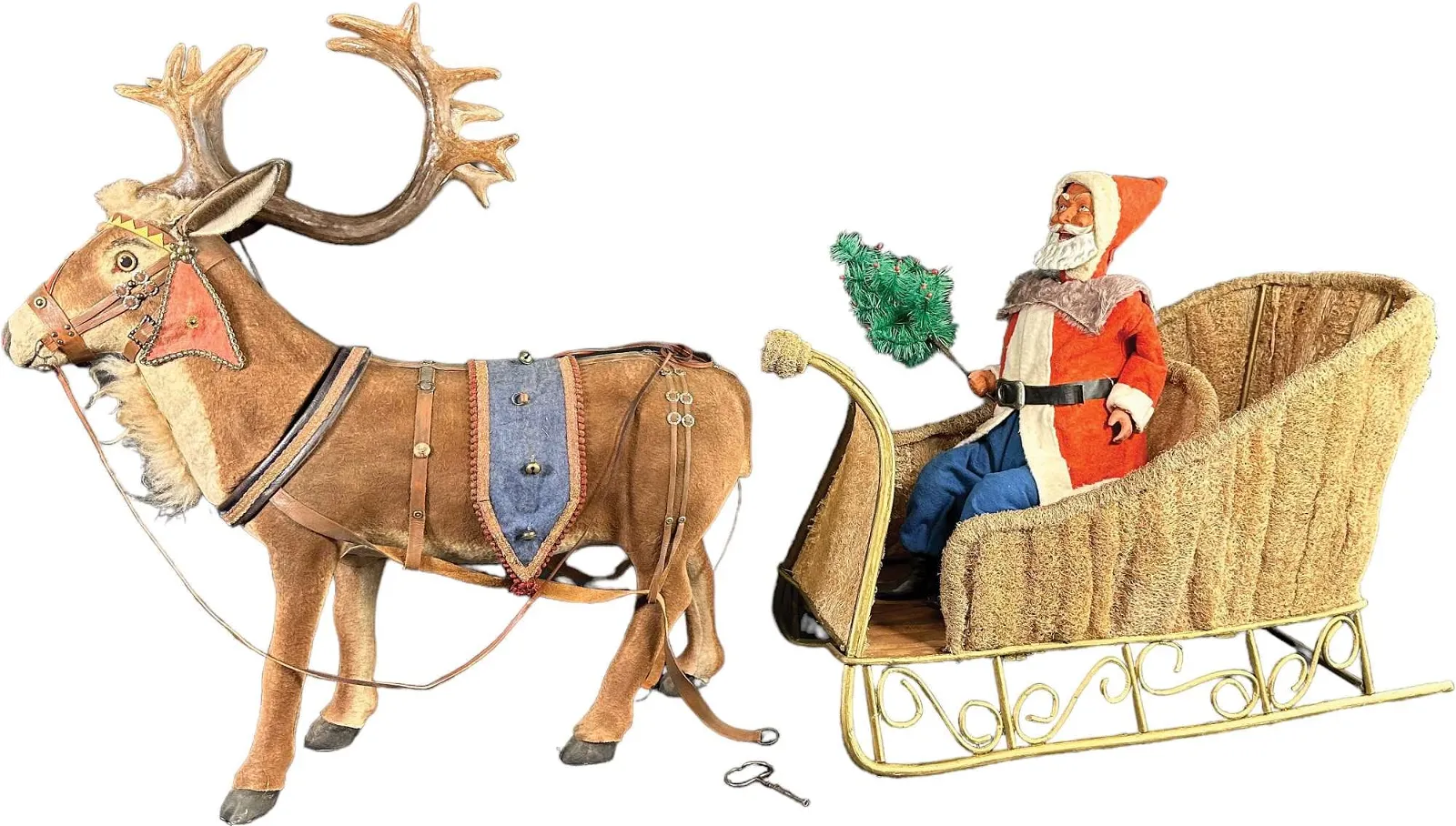 Huge Clockwork Santa In Moss Sleigh with Reindeer, $12,000-$18,000 at Bertoia Auctions.