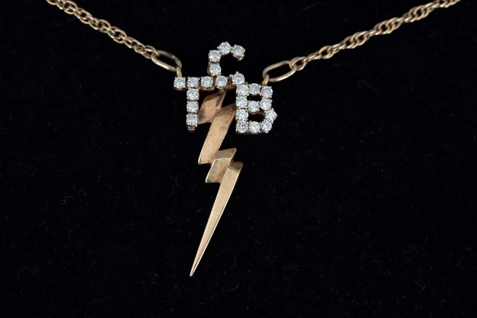 Elvis Presley-gifted Diamond and 14K Taking Care of Business in a Flash necklace, $200,000-$225,000 at GWS Auctions.
