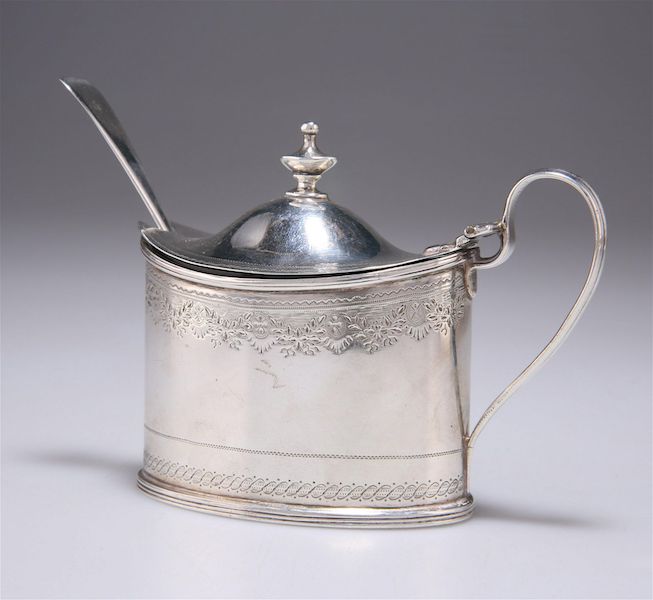 A George III silver mustard pot with associated silver spoon, dating to 1797 by Charles Chesterman II of London, sold for £120 ($152) plus the buyer’s premium in May 2023. Image courtesy of Elstob Auctioneers and LiveAuctioneers.