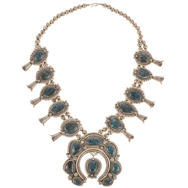 A silver and turquoise squash blossom necklace, likely Navajo, attained $25,000 plus the buyer’s premium in July 2023. Image courtesy of Alex Cooper Auctioneers and LiveAuctioneers.