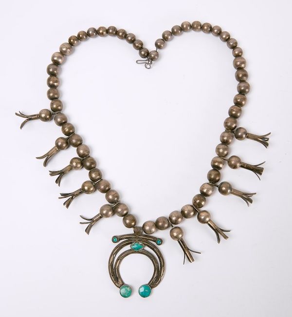 A 19th-century Navajo squash blossom necklace, described as being in ‘excellent condition,’ sold for $2,600 plus the buyer’s premium in January 2024. Image courtesy of New England Auctions – Fred Giampietro and LiveAuctioneers.