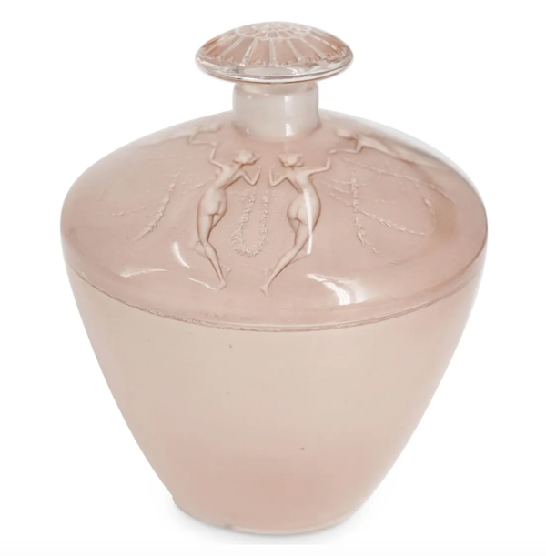 This circa-1920s-1930s René Lalique Trois Groupes De Deux Danseuses perfume bottle brought $47,500 plus the buyer’s premium in April 2022. Image courtesy of Akiba Galleries and LiveAuctioneers.