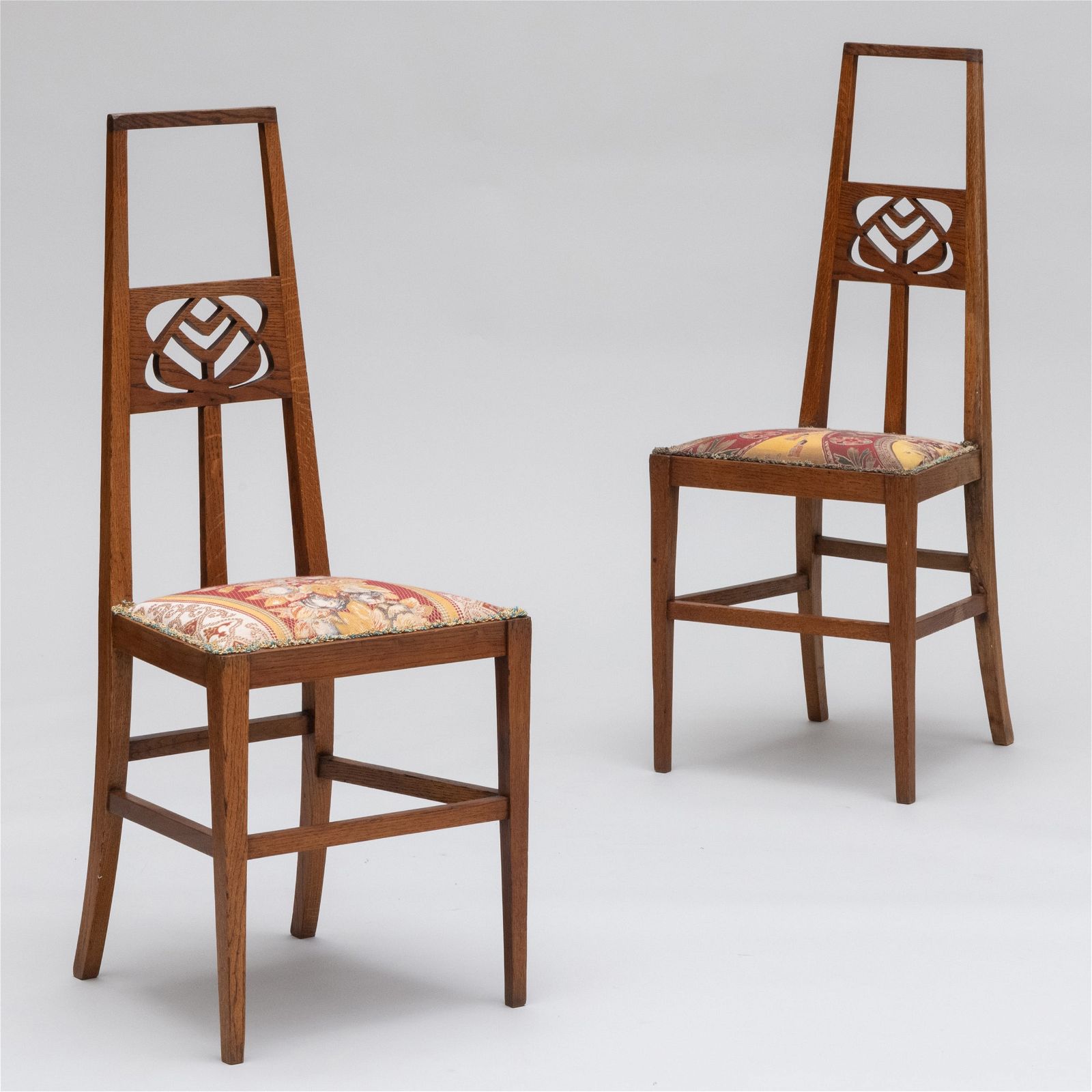 Pair of Arts and Crafts oak hall chairs by E.A. Taylor, estimated at $500-$700 at Stair Galleries.