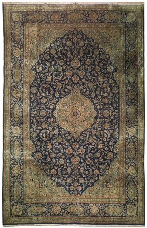Vintage Persian Kashan handmade wool rug, primarily Navy blue but also featuring shades of green, rust, and salmon, estimated at $3,500-$4,000 at Jasper52.