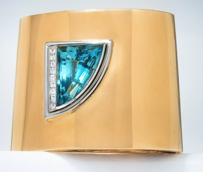 A bicolor gold and diamond bangle bracelet set with a large aquamarine, designed by Paloma Picasso for Tiffany & Co., achieved $30,000 plus the buyer’s premium in May 2023. Image courtesy of Hindman and LiveAuctioneers.