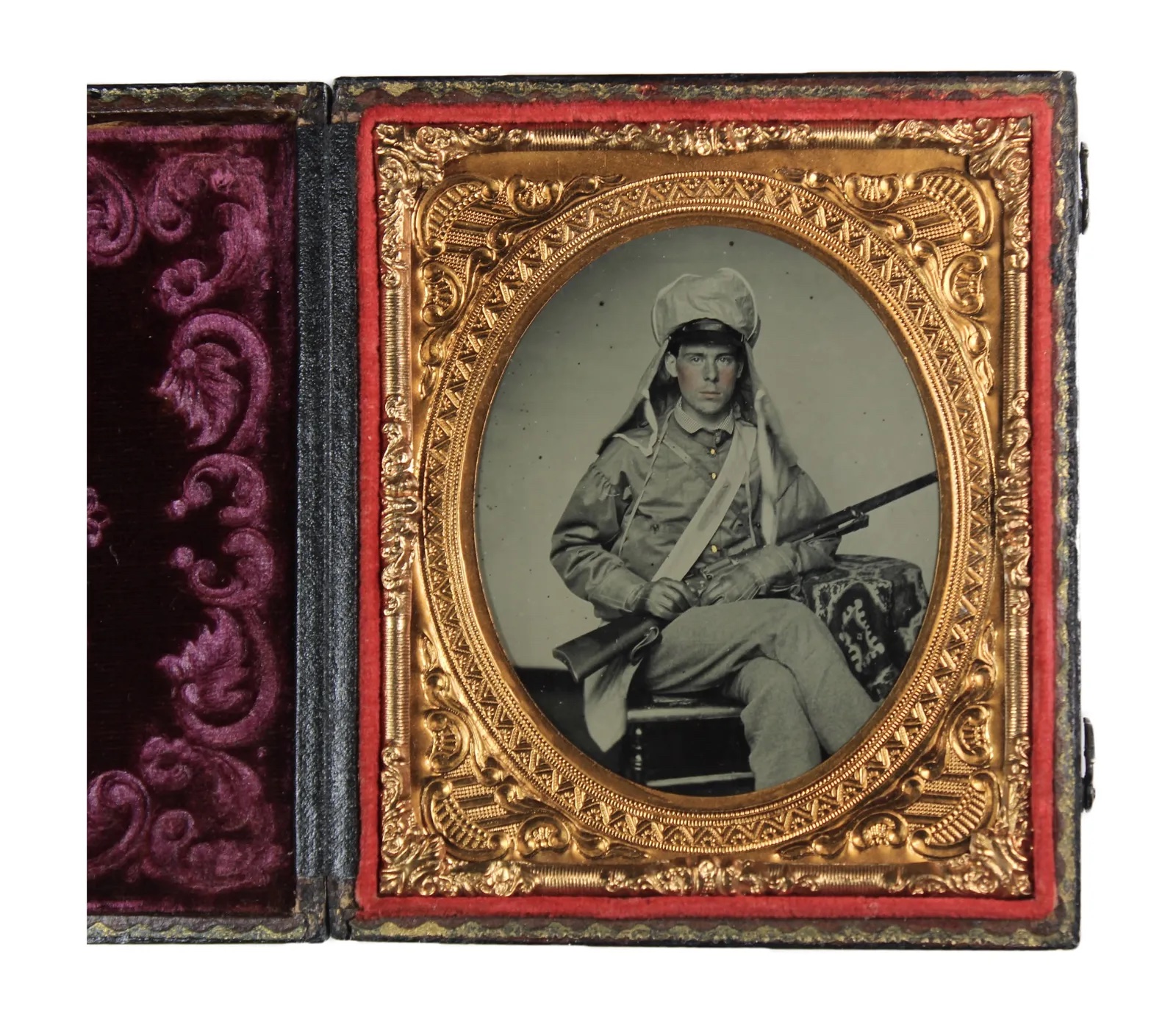 Circa-1862 ambrotype of a Confederate soldier holding a Colt M1855 revolving rifle, which sold for $26,500 ($32,595 with buyer’s premium) at Fleischer's.
