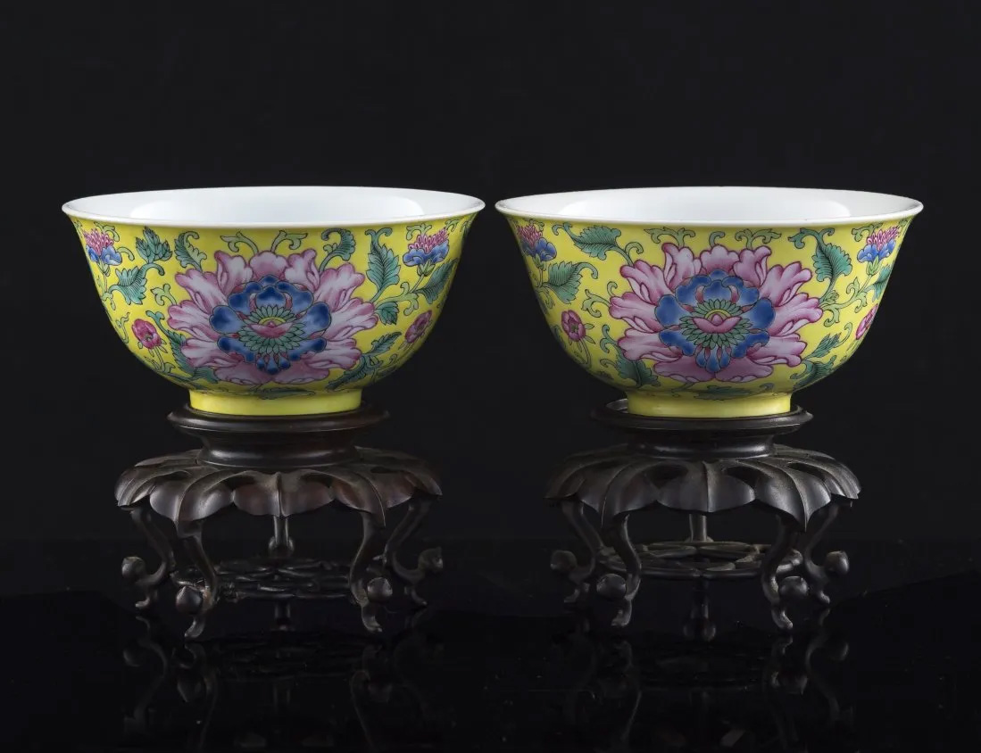 A pair of Daoguang (1820-50) mark and period yellow-ground famille rose 'peony' bowls, $80,000 at Oakridge Auction Gallery.