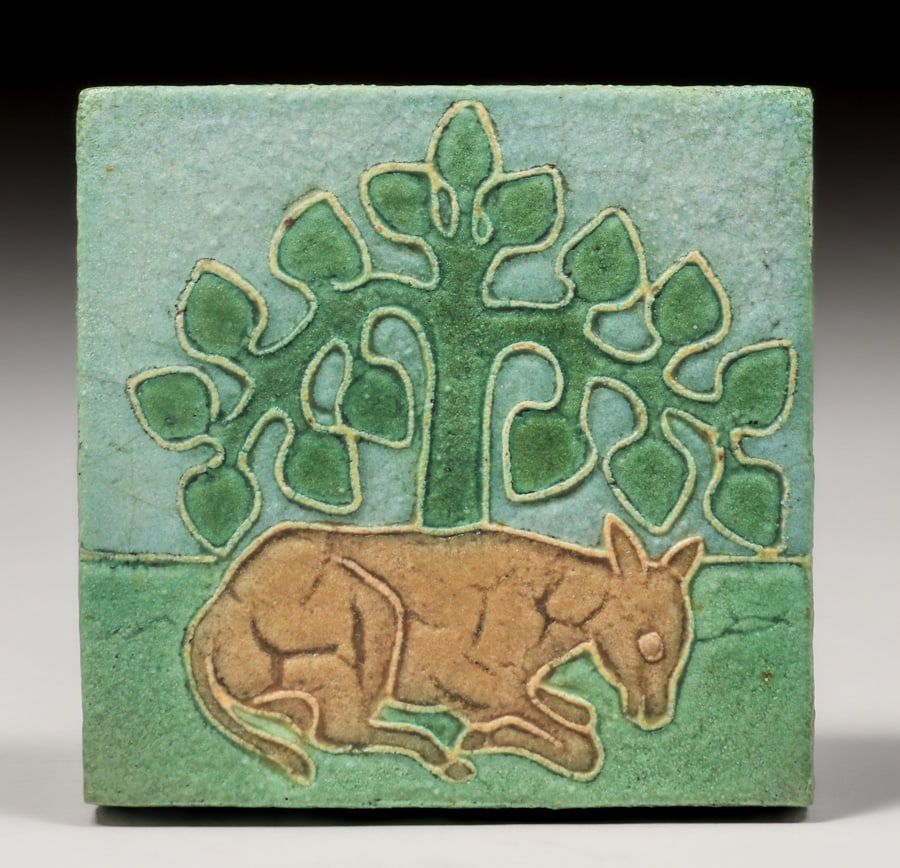 Circa-1905 Grueby faience tile with an image of a horse under a tree, estimated at $1,200-$1,500 at California Historical Design.