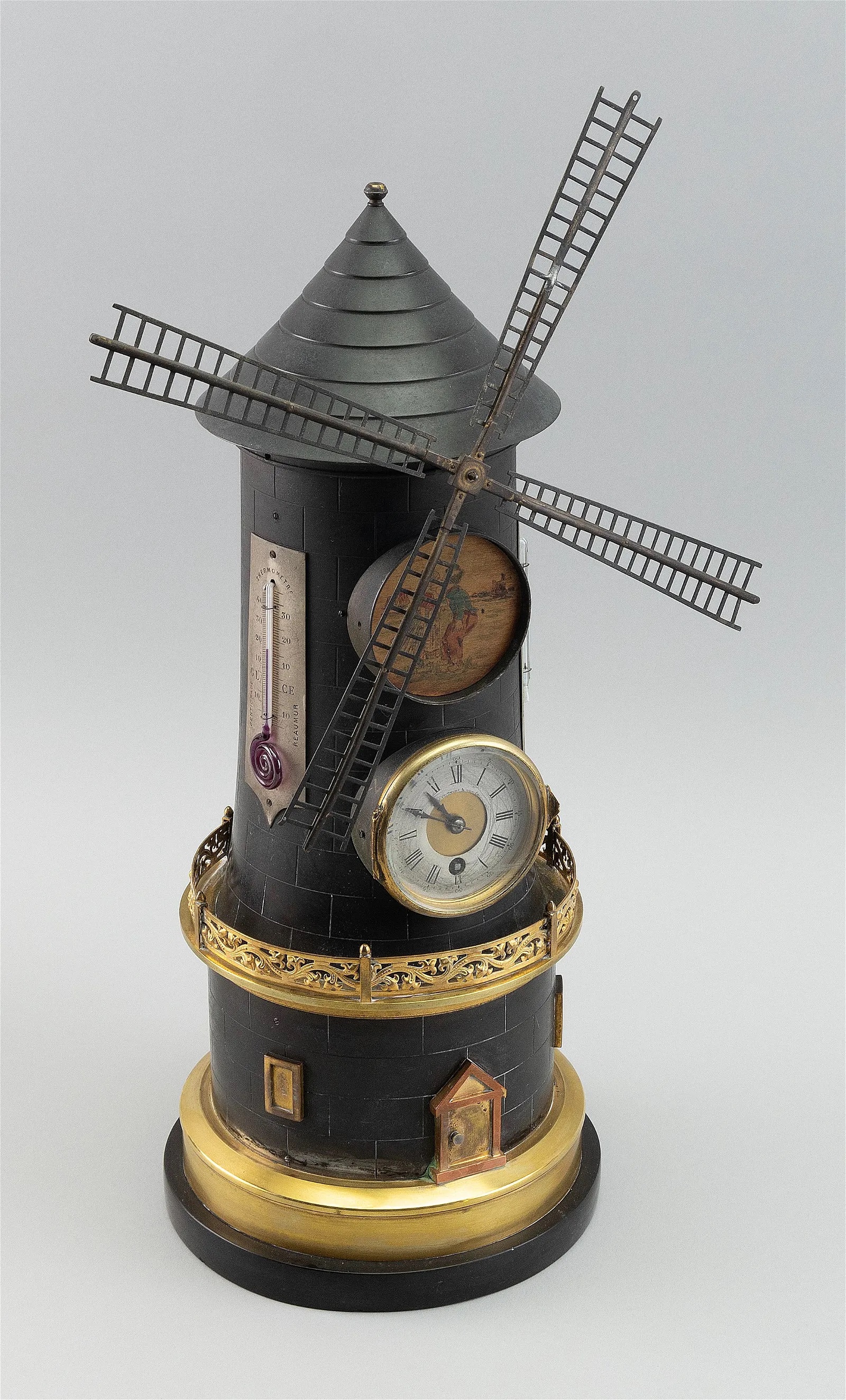 French Industry clock in the form of a windmill, estimated at $3,500-$5,000 at Eldred's.