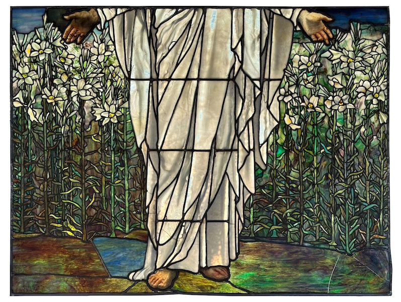 Detail of a circa-1898 window by Tiffany Studios, ‘Jesus in a Field of Lilies’, which achieved $190,000 plus the buyer’s premium in January 2023. Image courtesy of Fontaine’s Auction Gallery and LiveAuctioneers.