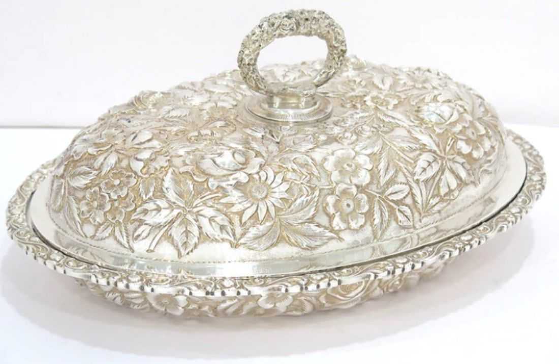 Sterling silver Baltimore repoussé serving dish and cover, estimated at $2,800-$3,800 at SJ Auctioneers.