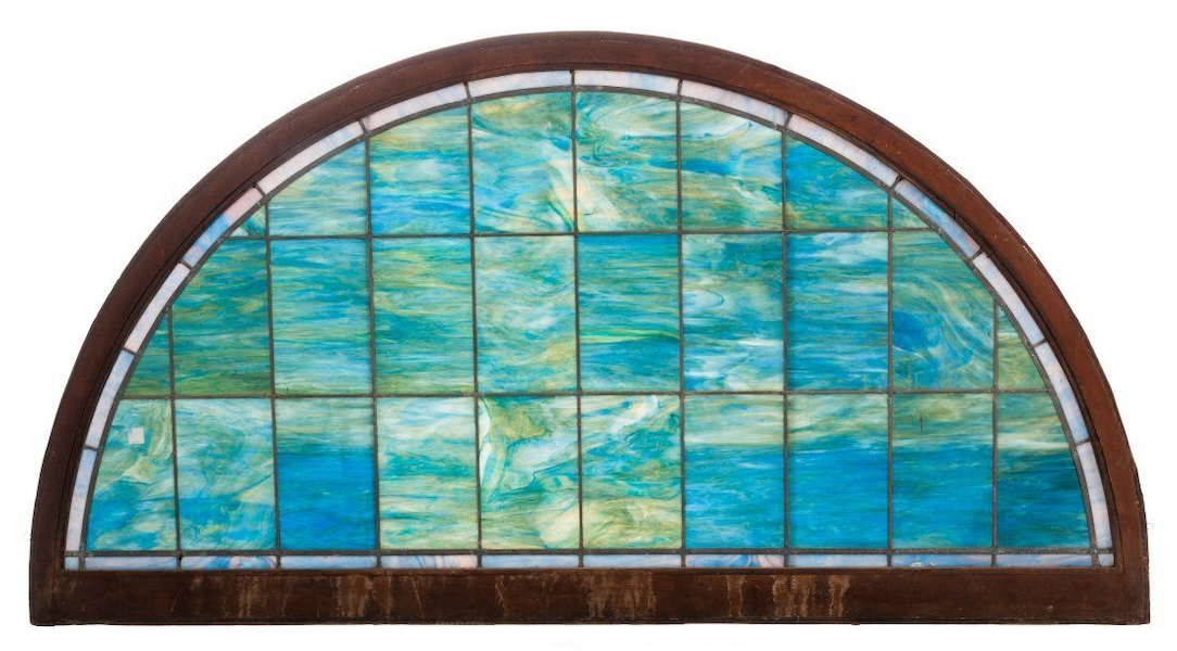 Originally made for a church but not featuring ecclesiastical subject matter is a circa-1922 Tiffany Studios leaded glass transom window that sold for $10,000 plus the buyer’s premium in November 2019. Image courtesy of Heritage Auctions and LiveAuctioneers.