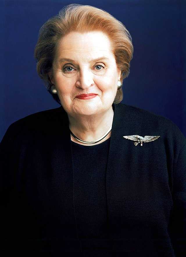 Madeleine Albright, shown in her circa-1997 official portrait as the US secretary of state, prominently wearing a spread-winged eagle pin. Image courtesy of Wikimedia Commons, which states that as a work of the US federal government, the image is in the public domain.