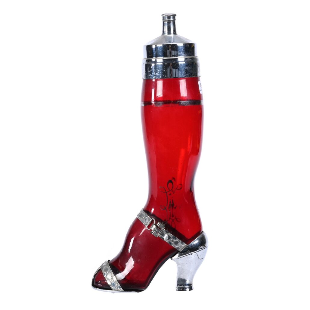 ‘Shake a Leg’ ruby glass and chrome plated novelty cocktail shaker, estimated at $1,500-$2,500 at Woody Auction on April 20.
