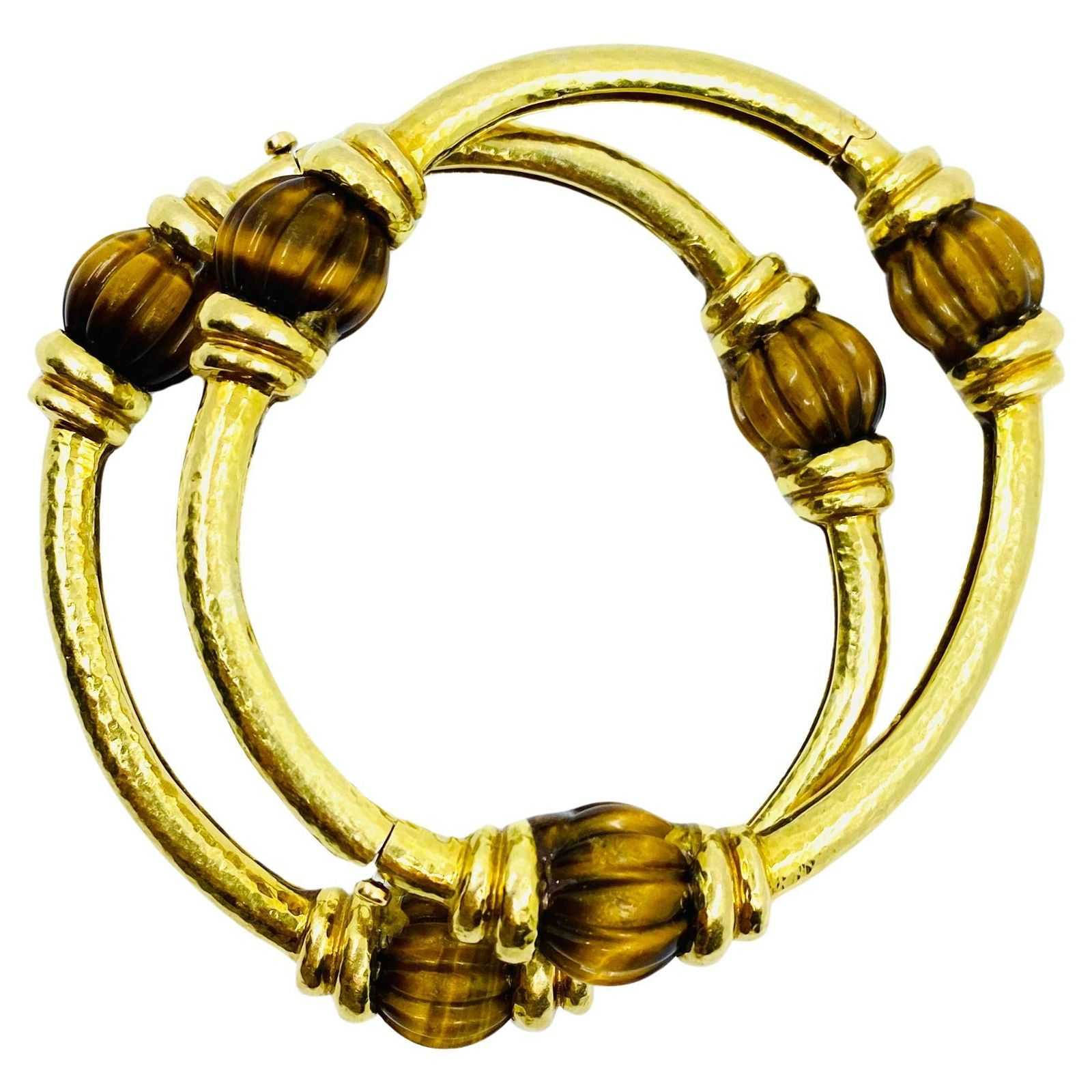 Pair of 18K gold and tiger’s eye bracelets by David Webb, estimated at $32,000-$38,000 at Jasper52.