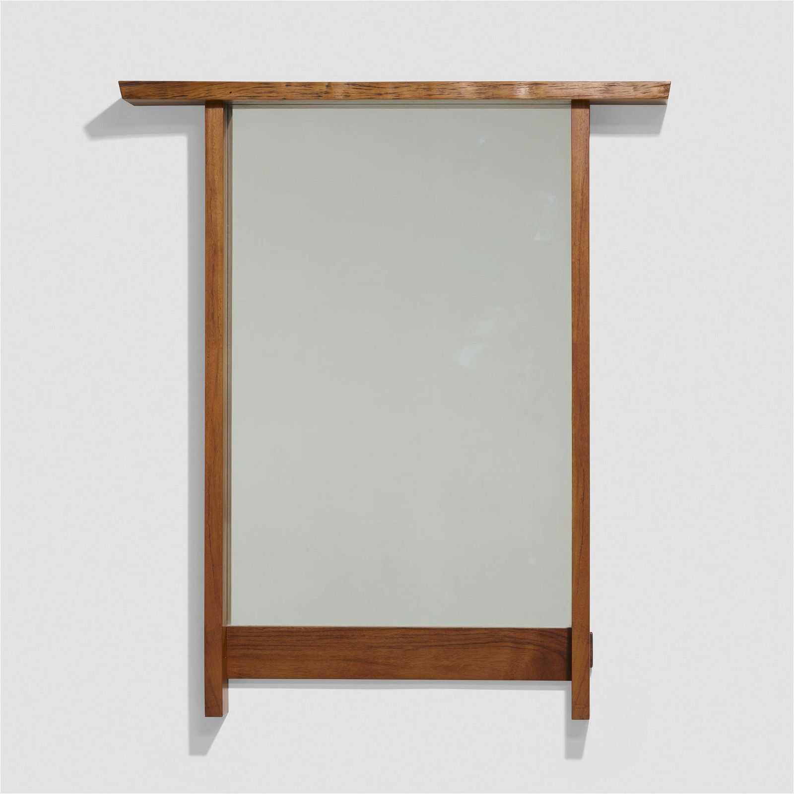 George Nakashima mirror dating to 1973 and having an East Indian rosewood frame, which sold for $11,000 plus the buyer’s premium in September 2022. Image courtesy of Rago Arts and Auction Center and LiveAuctioneers.