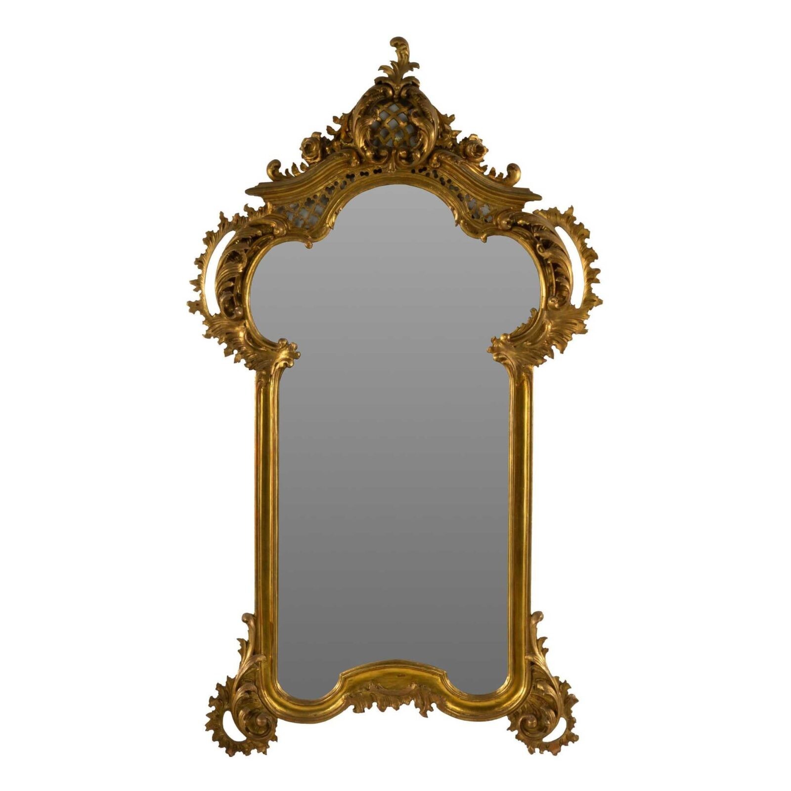 Italian Rococo-style wall mirror with elaborate gilt foliate carvings and a shaped giltwood frame, which sold for $2,100 plus the buyer’s premium in May 2024. Image courtesy of Vogt Auction Texas and LiveAuctioneers.